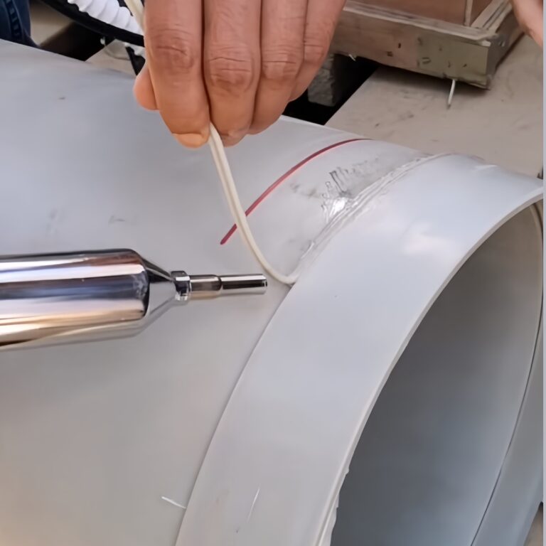 a-pair-of-hands-are-welding-white-white-gray-plastic-round-barrels.