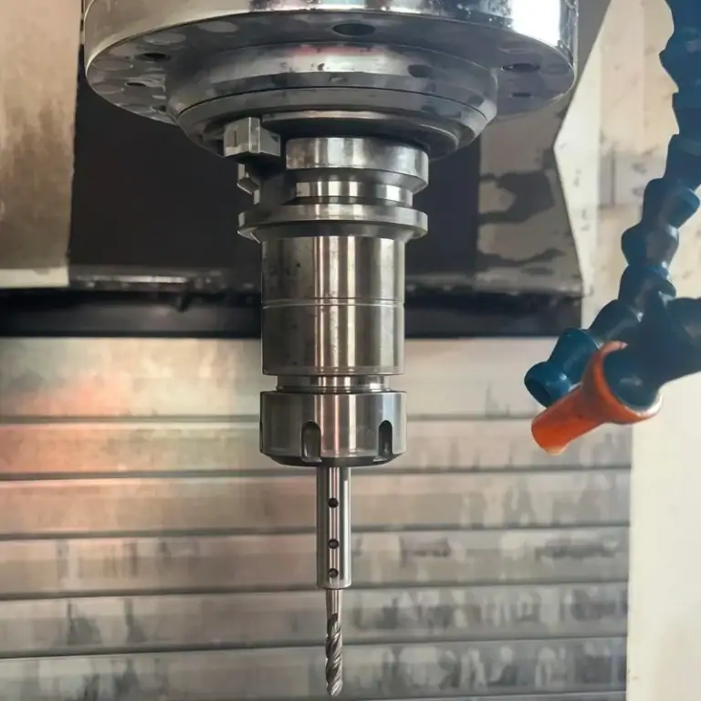 Precision part CNC drilling at vertical machining center spindle drilling station