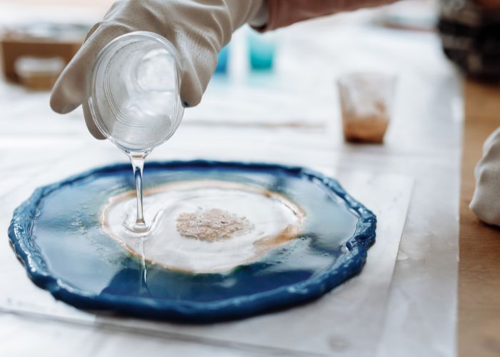 worker-conducting-resin-related-processing-operation-resin-vs-plastic