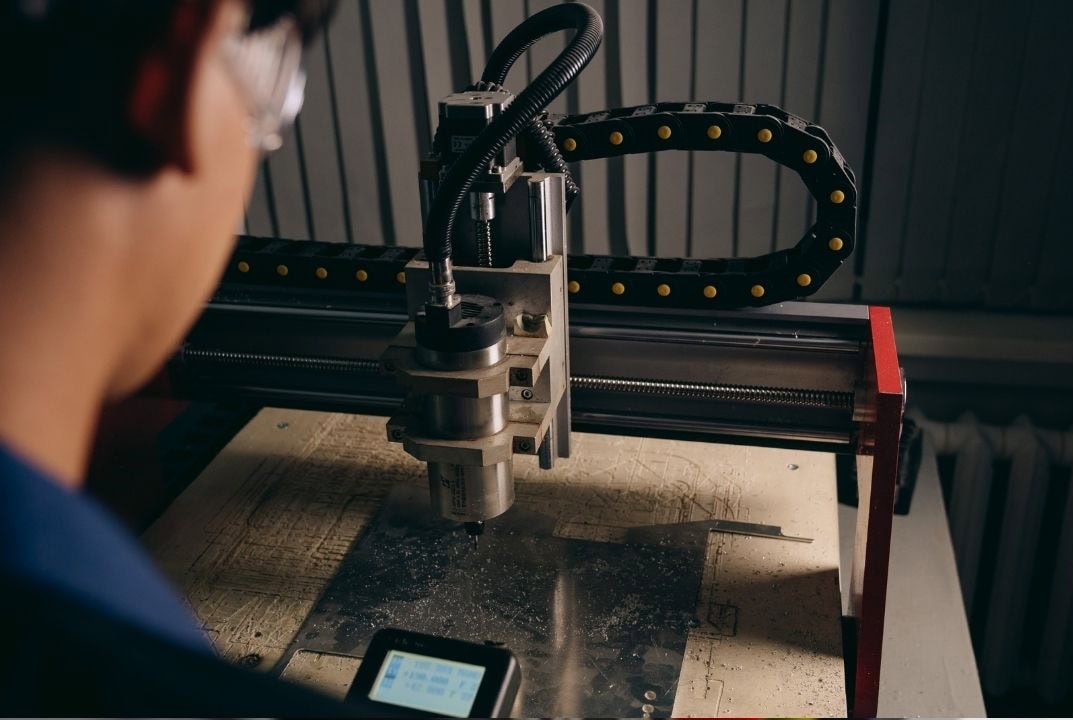 The machine executes the CNC Programming