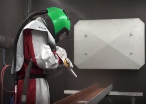 worker-performing-shot-peening-on-316-steel-parts-1-bead-blasting