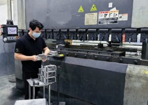 single-person-black-sheet-metal-bending-operation-picture-1