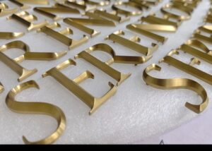 gold-titaniumalloy-milling-letter-smallbatch-titanium-anodizing