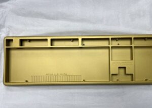 Custom brass CNC machined fixture with threaded holes and steel bolts