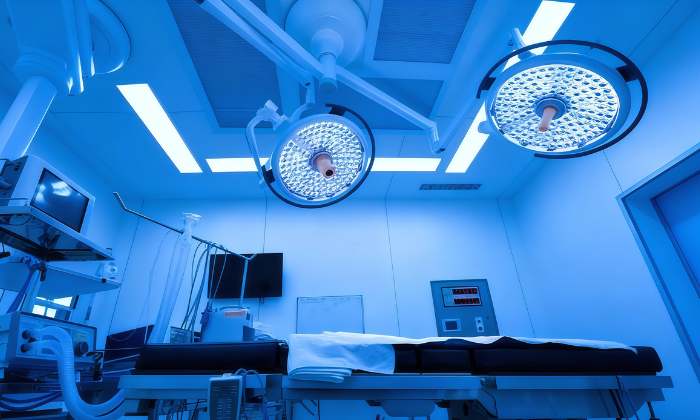 Modern operating room with surgical lights and equipment