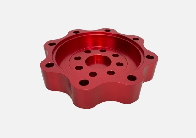 CNC machined aluminum part with red anodized surface finish