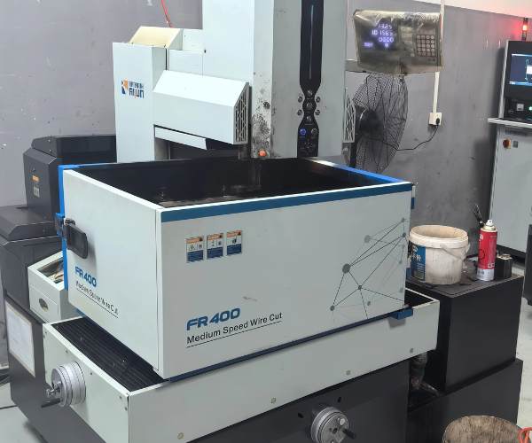 Wire EDM machining producing complex contours on a hardened steel component