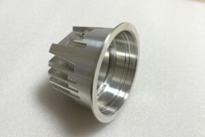 Precision CNC-machined aluminum prototype part for lighting applications, featuring fine surface finishing and complex geometry.