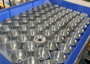 Batch of machined aluminum parts produced through CNC precision machining