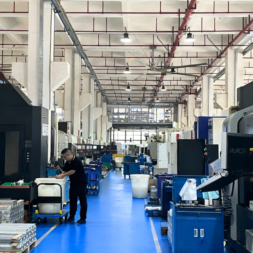 Digitalization and automation in CNC machine shop showing CAD/CAM integration, robotic automation, and smart machining systems