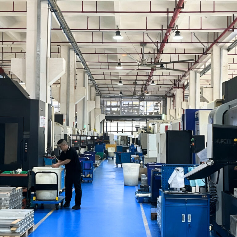 Digitalization and automation in CNC machine shop showing CAD/CAM integration, robotic automation, and smart machining systems