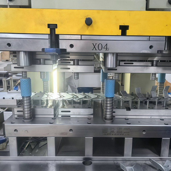 Progressive die metal stamping machines producing complex, high-precision parts in a continuous process