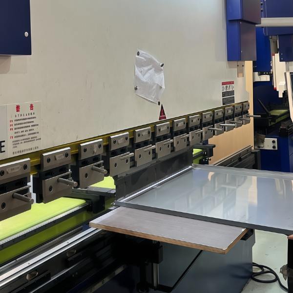 Advanced press brake machines forming metal sheets into precise angles for sheet metal fabrication projects