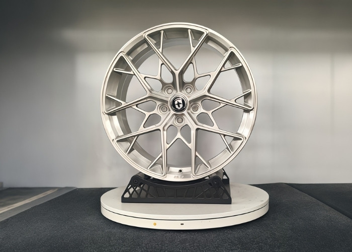 Five-axis CNC machined aluminum wheel rim displayed as cnc complex parts