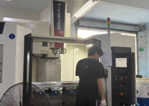 Operator performing precision milling on CNC Complex Partsd
