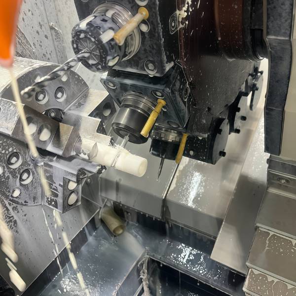CNC turning of white POM plastic part with smooth surface and tight tolerance