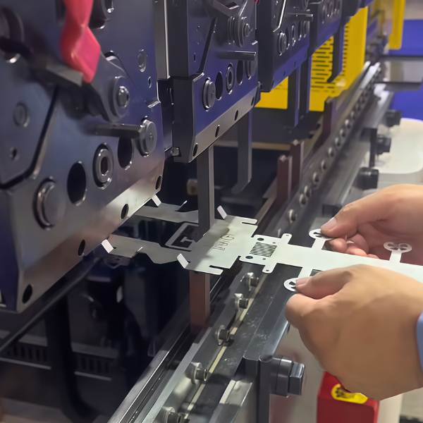 Sheet metal fabrication for automotive body panels, battery covers, and brackets