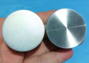 Stainless steel part surface comparison before and after bead blasting, showing matte satin finish versus raw machining marks