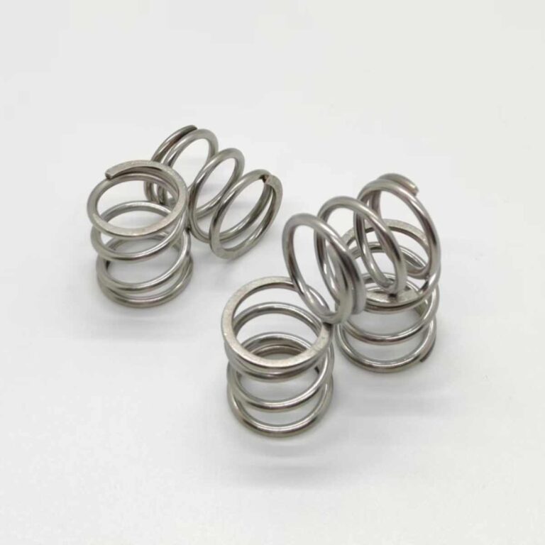 Single compression coil spring close-up illustrating basic types of springs and applications in mechanical design