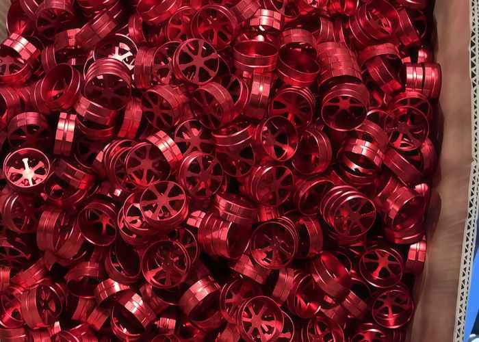 Newly machined red anodized aluminum component with smooth surface finish, demonstrating the effect discussed in what is anodized aluminum