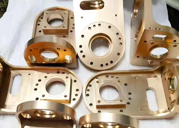 CNC machined metal component with overlapping holes and complex structural geometry