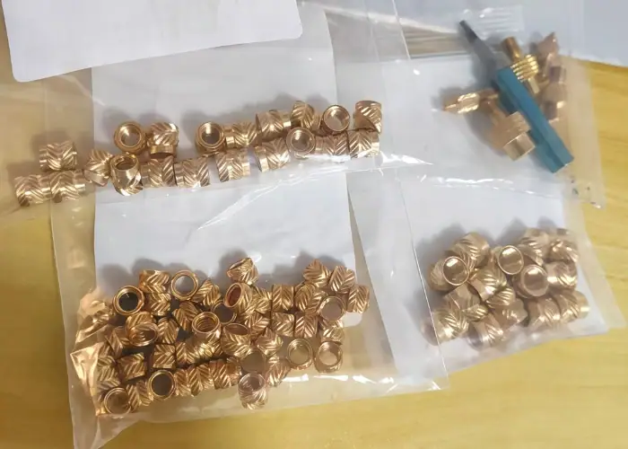 Electroplated brass heat-set insert for electronics industry applications