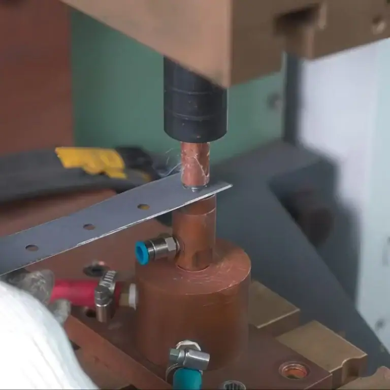 Close-up of tack welding process used to temporarily join metal parts