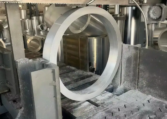 6061 aluminum round bar band saw cutting at large band saw machine station