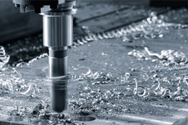 This is a picture of a milling cutter cutting a metal workpiece.