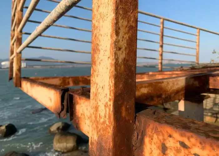 Metal oxidation and rust formation on an outdoor steel structure exposed to moisture