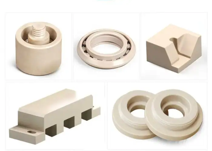 CNC machined PEEK parts with threaded, bearing, and structural features for industrial precision component applications