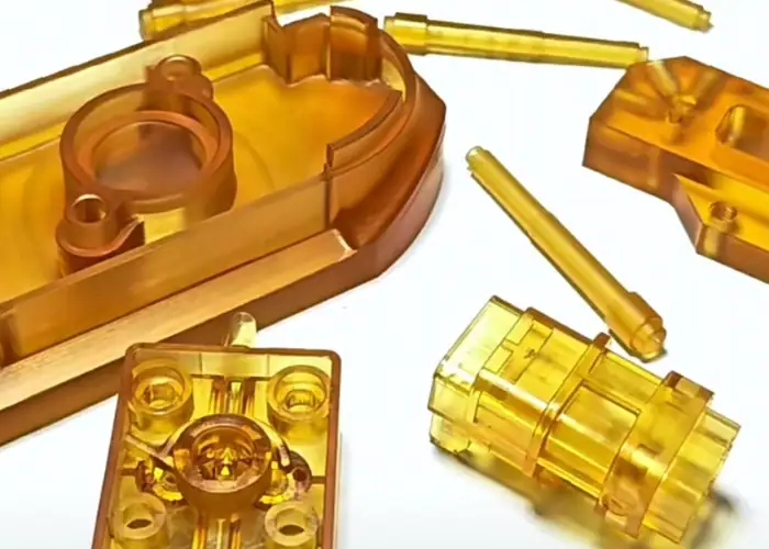 CNC machined ULTEM parts with transparent amber finish for high-performance industrial applications