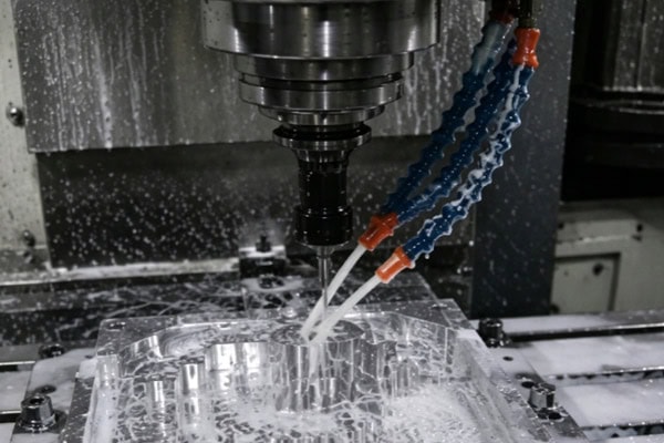 Images of CNC milling machines performing milling operations.
