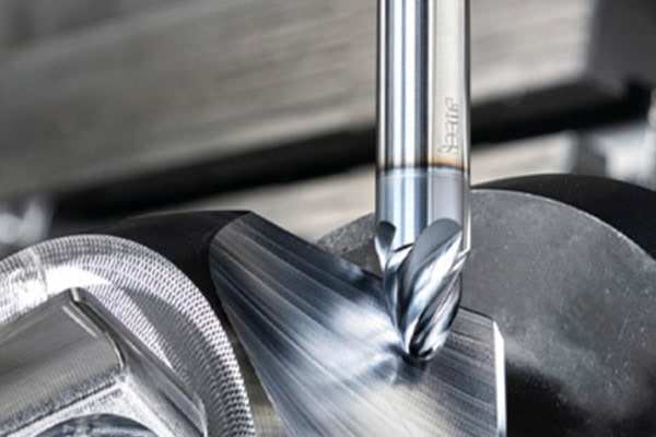 Images of precision milling operations performed by CNC machining centers.
