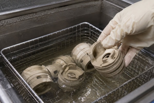 Ultrasonic cleaning of PEEK plastic parts