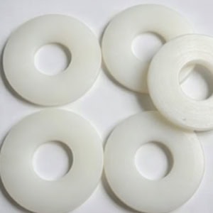 These gaskets are machined by CNC turning/milling. Their core functions are insulation, anti-loosening, wear resistance, cushioning, and sealing. They replace traditional metal gaskets and are widely used in electrical equipment, chemical machinery, and automated equipment.