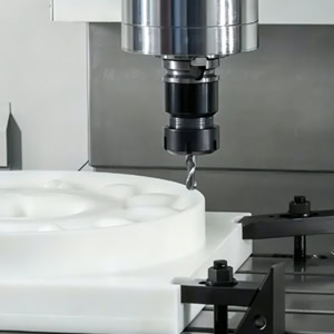 CNC machine tool machining of large white plastic parts