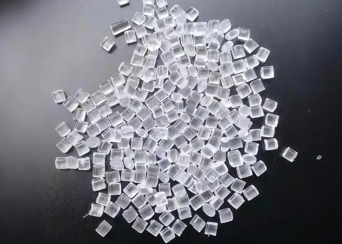 Clear PMMA plastic pellets used in a PEEK vs PMMA material comparison