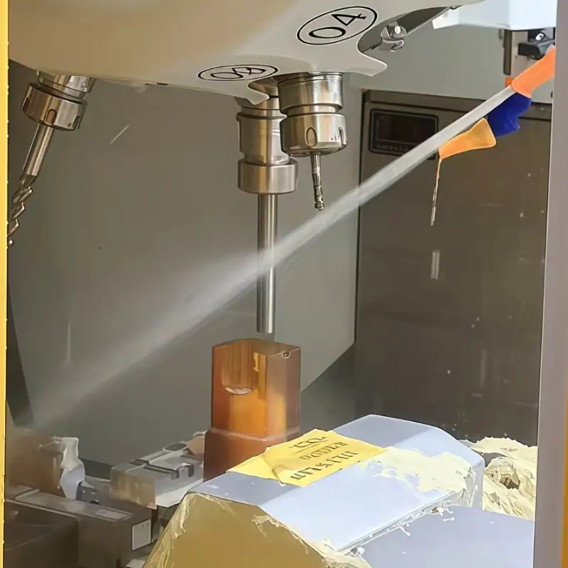 Precision CNC machining of ULTEM 1000 plastic block with coolant for tight-tolerance parts