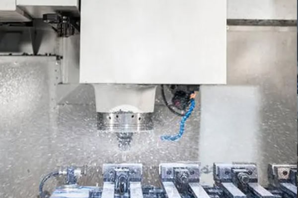 Vertical CNC machining center for batch metal milling.