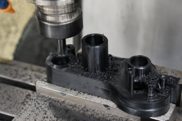 CNC machining a black plastic part