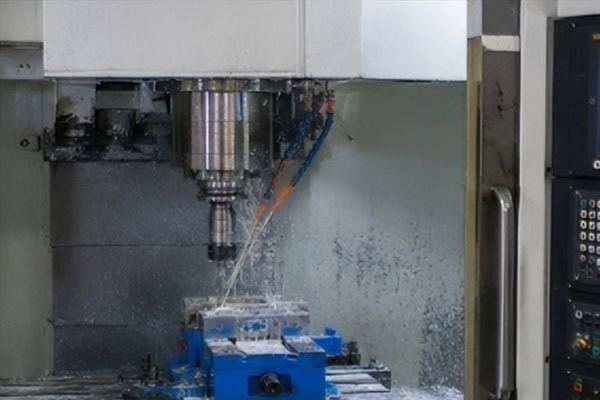 CNC machining centers carry out automated milling processes.