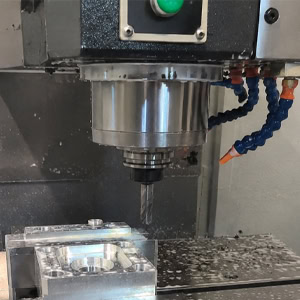 Drilling with a vertical CNC machining center.