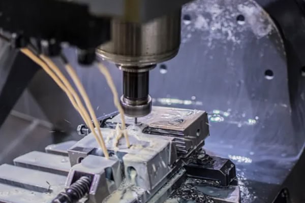 Images of precision milling on a CNC machining center.