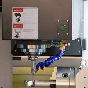 Vertical CNC machining center cutting process.