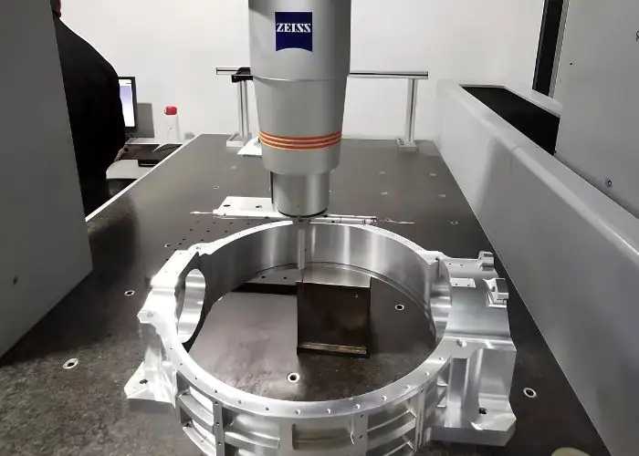 Aluminum part CMM inspection showing dimensional measurement and quality control for precision machined components