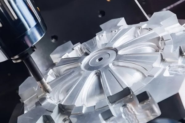 CNC machining center for milling automobile wheel hub molds.