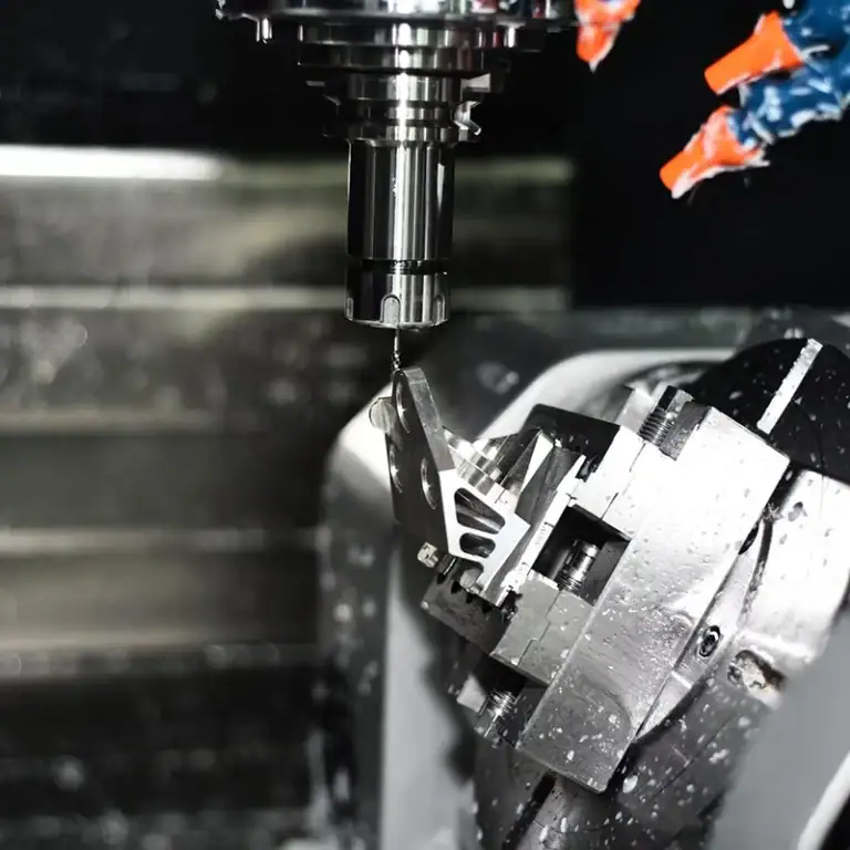 Five-axis CNC machine using G Code to manufacture a complex precision part