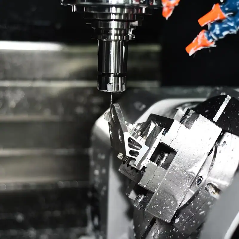 Five-axis CNC machine using G Code to manufacture a complex precision part