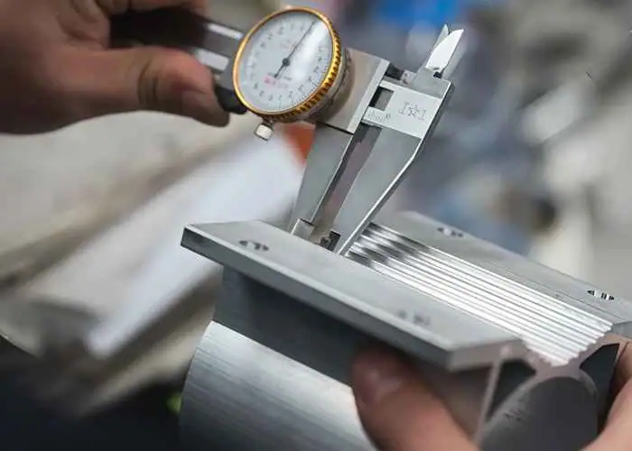 5052 aluminum part precision inspection showing dimensional measurement and quality control for machined components